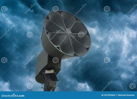 Storm Siren and Dark Clouds Stock Photo - Image of public, acoustic: 287595842