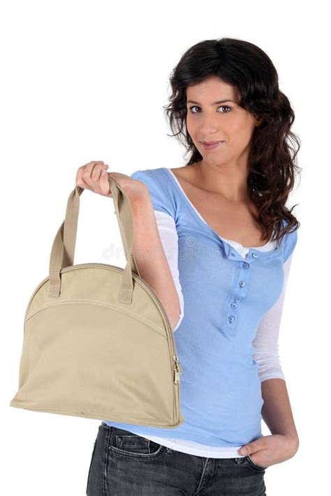 Woman holding handbag stock image. Image of attractive - 21257617