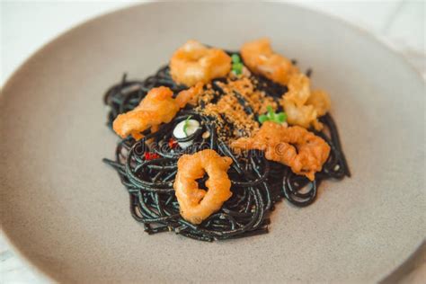 Black Squid Ink Pasta is Paired with Scallops on Pasta Dish Stock Photo ...