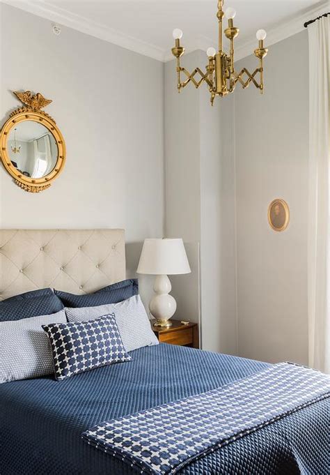 Gray and Gold Bedroom with Gold Mirror Over Headboard - Transitional ...