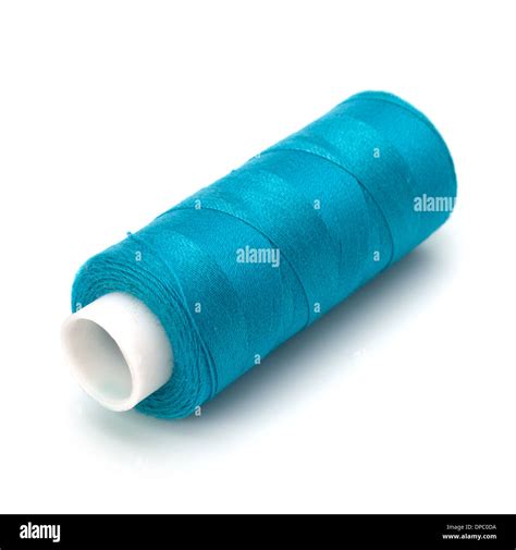 Blue spool of thread isolated on white background Stock Photo - Alamy