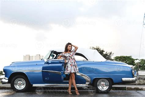 Beautiful woman driving a retro convertible car 16250367 Stock Photo at Vecteezy