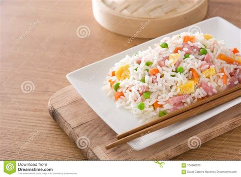 Chinese Fried Rice with Vegetables and Omelette on Wooden Table. Stock ...