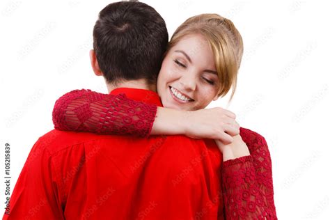 Girl hugging boyfriend romantically. Stock Photo | Adobe Stock