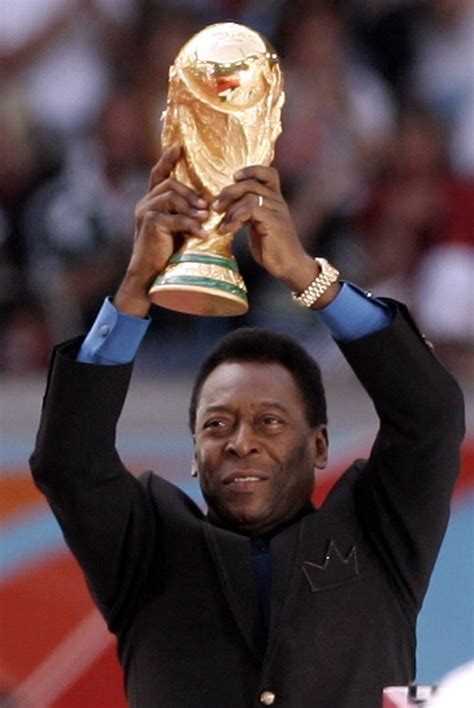 09.06.2006 Pele (Brasil) lifts up the Jules Rimet Cup (World Cup Trophy) – Surge Soccer