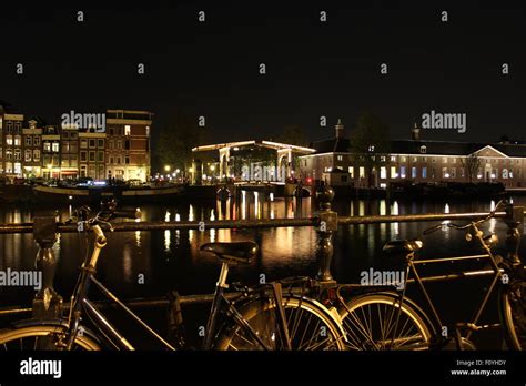 Amsterdam canal by night Stock Photo - Alamy