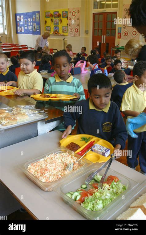 primary school canteen being served healthy food Stock Photo - Alamy