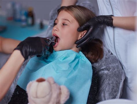 Dentist Use Anesthetic Injection for Tooth Extraction in Child. Stock Image - Image of carious ...