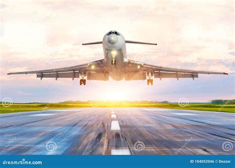 Passenger Airplane Landing at Sunset on a Runway. Stock Photo - Image of speed, takeoff: 104052046