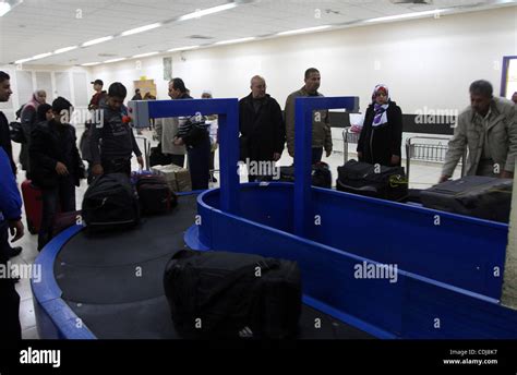 Palestinians returning from Egypt cross through the Rafah crossing on ...