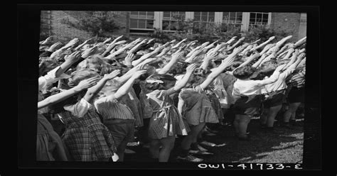 School children pledging their allegiance to the flag with the Bellamy salute described by ...