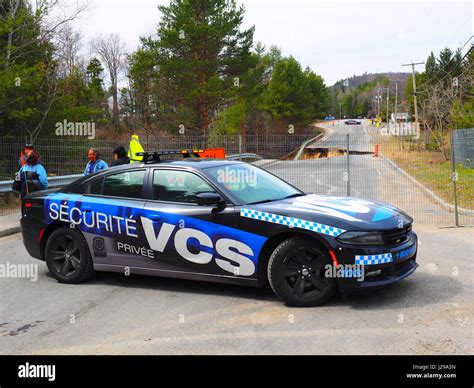 A private security car blocks off a street Stock Photo - Alamy