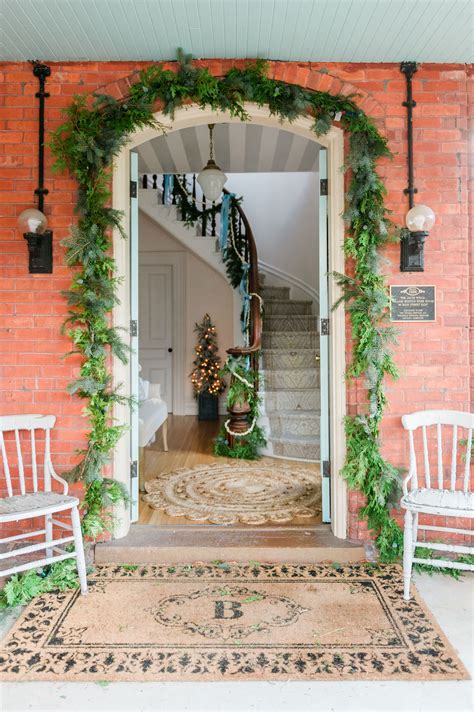 christmas entryway garland around doorway - The Leslie Style