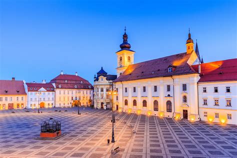 Sibiu, Romania. Large Square (Piata Mare) with the City Hall and Brukenthal palace in ...