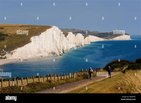 People walking near the seven sisters east sussex Stock Photo - Alamy