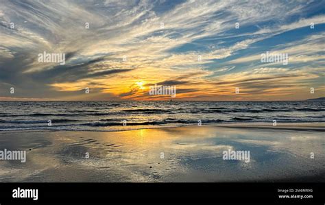 Colorful sunset lights up the beach, pier and ocean in Los Angeles Stock Photo - Alamy