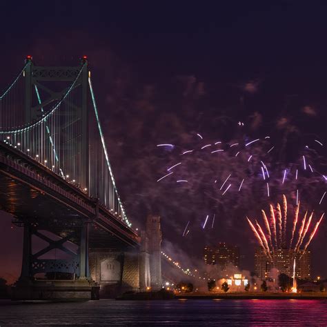 Benjamin Franklin Bridge and Fireworks In Philadelphia Pennsylvania Photograph by Linda Karlin