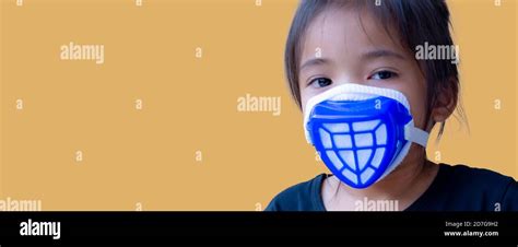 Portrait Asia kid wearing mask for protection pollution Stock Photo - Alamy