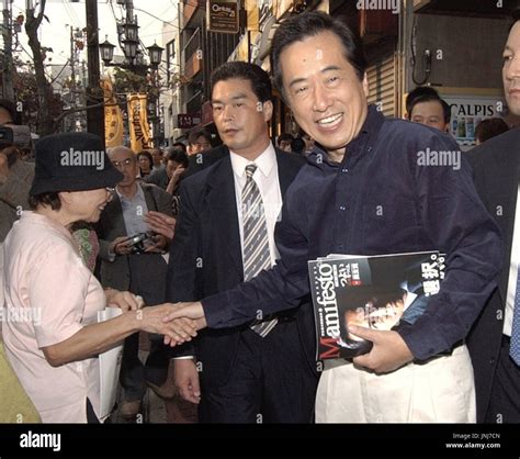 TOKYO, Japan -Democratic Party of Japan (DPJ) leader Naoto Kan shakes ...