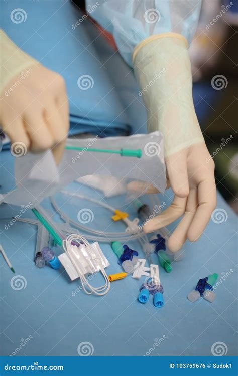 Medical Worker Opened the Pack of Catheterization Tools during P Stock Photo - Image of ...