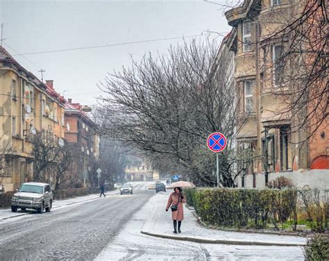 Snow Covered Streets of the Winter Old Town, Frosty Weather, a Woman Alone with an Umbrella ...