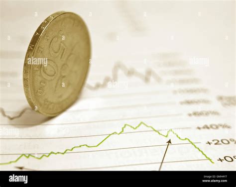 Coin on stock chart Stock Photo - Alamy