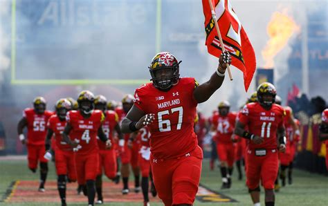 The UMD Football Team Comes Together to Kick a Booster Off a Plane ...