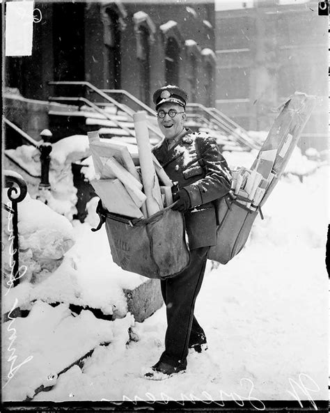 Mailman poses with his heavy load of Christmas mail and parcels ...