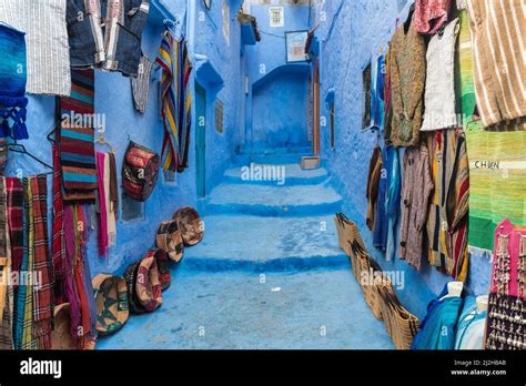 Morocco, Chefchaouen, Souvenirs for sale at traditional blue buildings ...