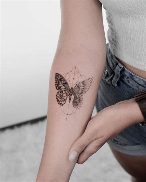 Single needle butterfly with an angel wing tattoo