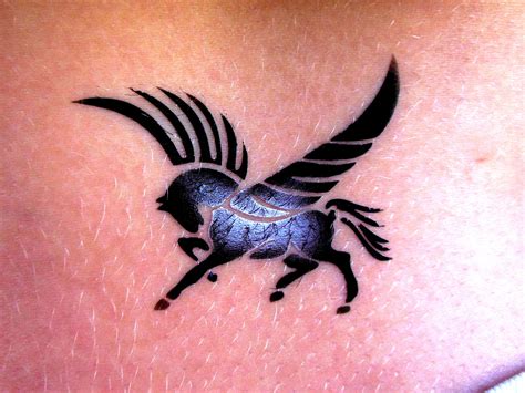 this cute little black Pegasus airbrush tattoo was put on the lower back of a teenage girl to ...