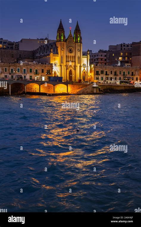 St. Julian town in Malta at night, illuminated Carmelite Church at Balluta Bay Stock Photo - Alamy