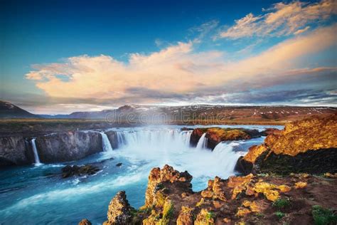 Godafoss Waterfall at Sunset. Fantastic Landscape. Beautiful Cumulus Clouds Stock Image - Image ...