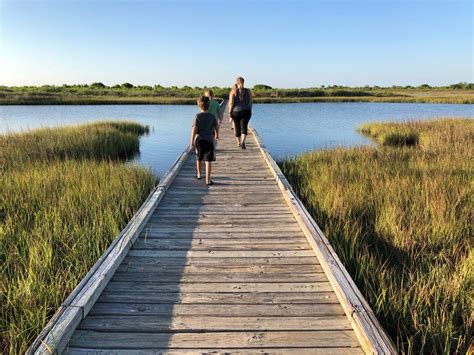 Family crossing over bridge on the Galveston Island Trail. #galvestonisland #galveston # ...