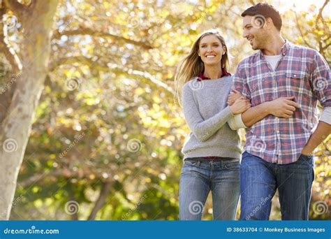 Romantic Couple Walking Through Autumn Woodland Stock Images - Image: 38633704