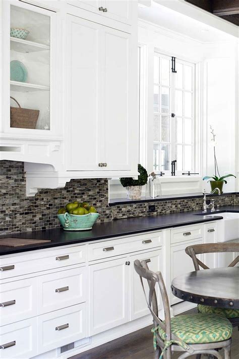 White cabinets with black countertops backsplash | City Of