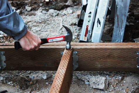 How to Install Deck Joists- You can use a hammer to force the joist - Homedit