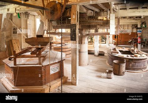 Interior of a working water mill Stock Photo - Alamy