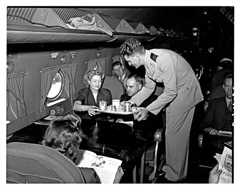 SAA Douglas DC-4 interior filled with passengers. Steward. - Atom site ...