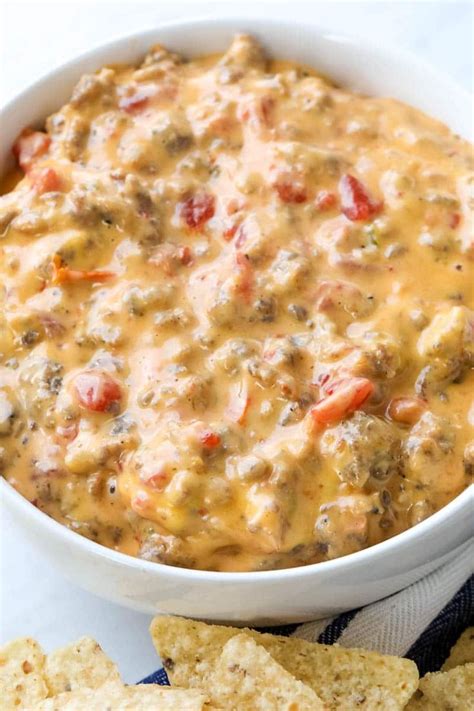 Rotel Dip is a 3-ingredient queso dip recipe with spicy sausage, Rotel, and Velveeta cheese ...