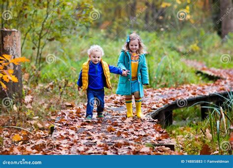 Kids Playing in Autumn Park Stock Image - Image of funny, little: 74885883