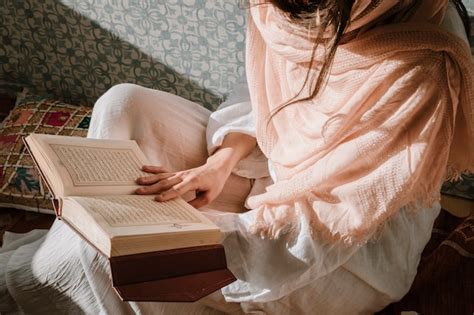 Free Photo | Sitting woman reading in quran