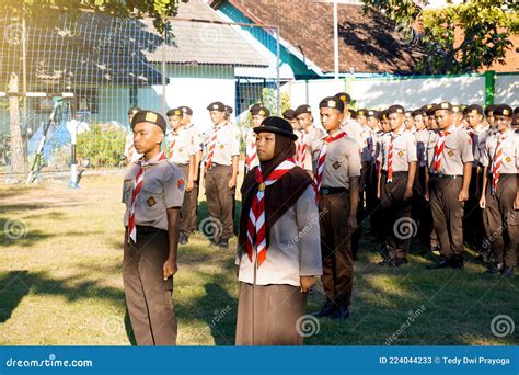 Indonesian High School Students Wearing Full Scout Uniforms Lined Up in the School Yard To Carry ...