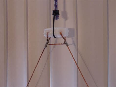 an electrical device mounted to the side of a wall in a room with white ...