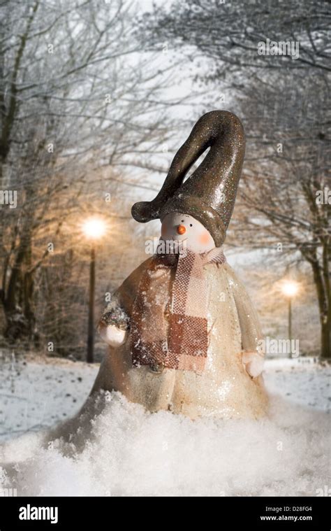 Cheerful figure in snowy winter night scene Stock Photo - Alamy