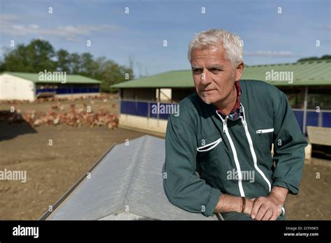 Portrait of farmer in poultry yard Stock Photo - Alamy