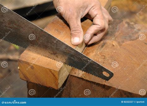 Sawing a wood stock image. Image of sawing, woodworking - 8232227