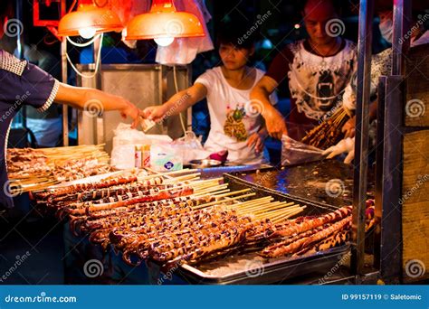 NANNING, CHINA - JUNE 9, 2017: Food on the Zhongshan Snack Street, a Food Market in Nanning with ...