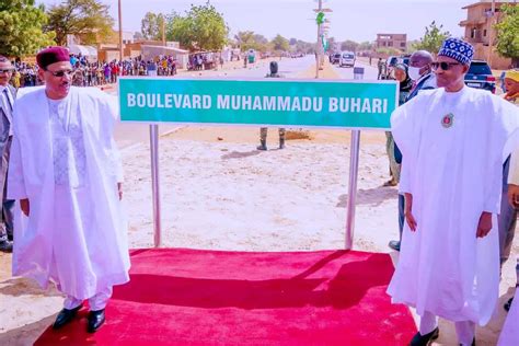 Photos Emerge as Buhari Lands in Top African Country for High-level Meeting, Gets New Road Named ...