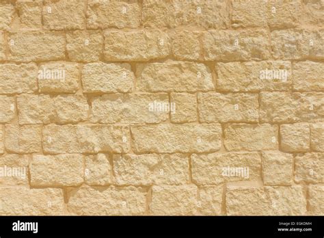 Sandstone brick wall background Stock Photo - Alamy